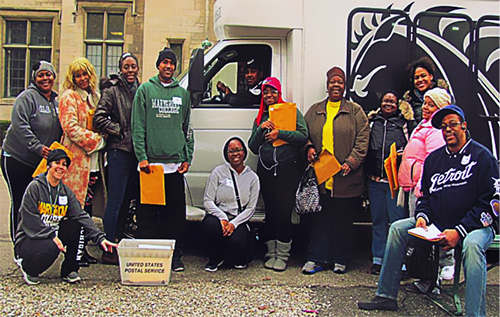 Social Research students and faculty posed in front of a truck in the Marygrove neighborhood
