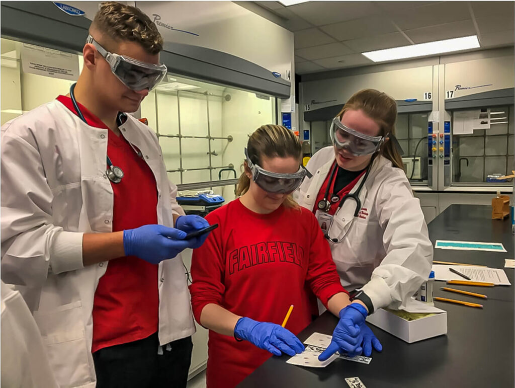 Figure 3. Students examining the results of chromatographic separation (Roney, 2020)